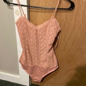 pink body suit
